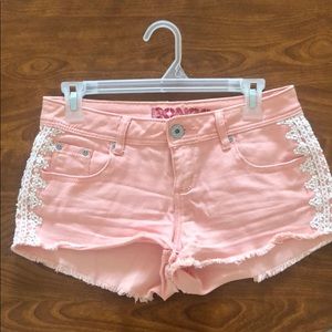 Pink with flower lace on the sides short shorts